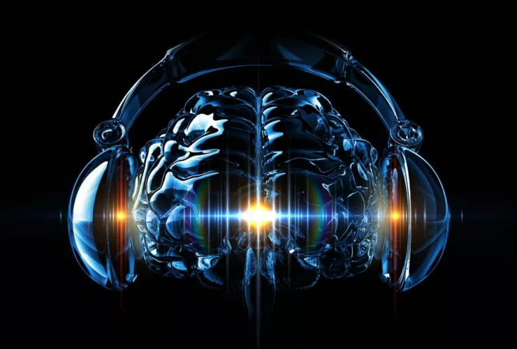 Illustration d’un cerveau humain translucide portant un casque audio, symbolisant la connexion entre musique et activité cérébrale.